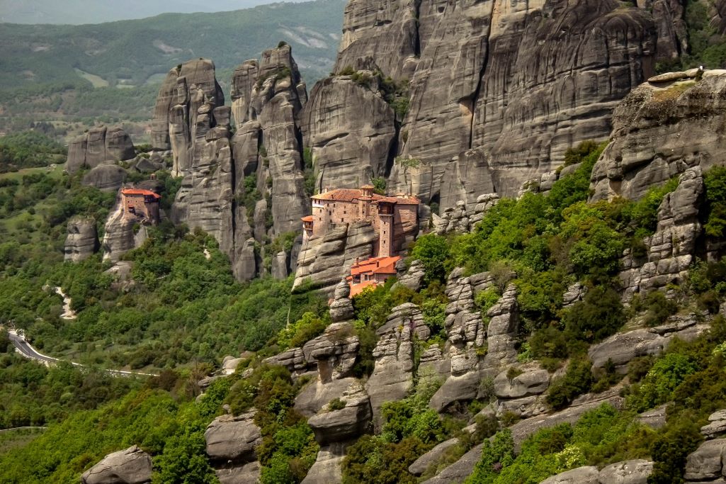 Monastery in Meteora, Greece with mountains around it