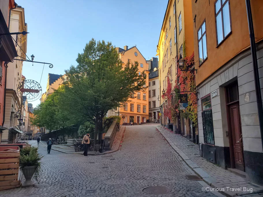 Colorful and charming medieval streets of the Gamla Stan (old town) in Stockholm, Sweden. Wandering the romantic streets of the Gamla Stan is the perfect thing to do on a layover in Stockholm.