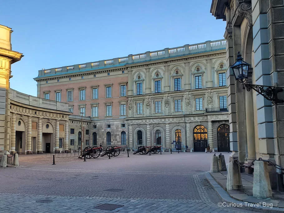 Swedish Royal Palace with cannons and the Royal Guard standing outside