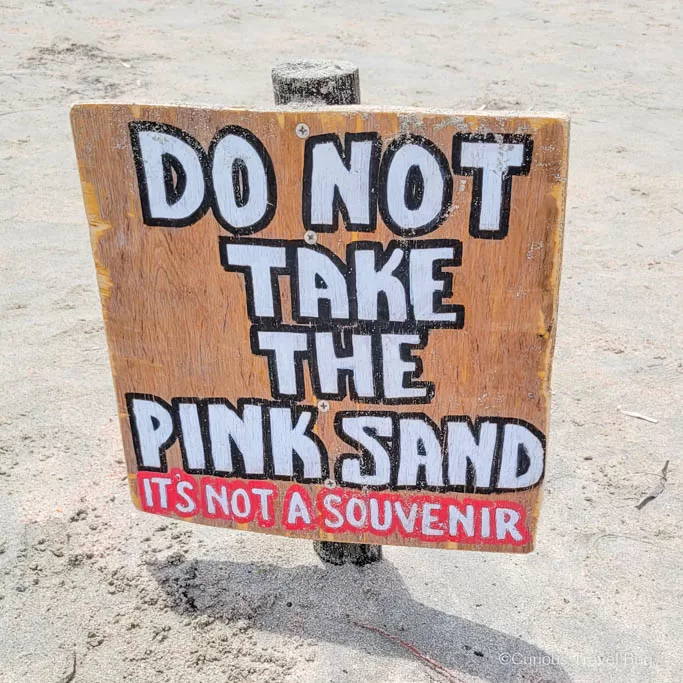 Sign that reads "Do not take the pink sand, it's not a souvenir" at Elafonisi Beach in Crete