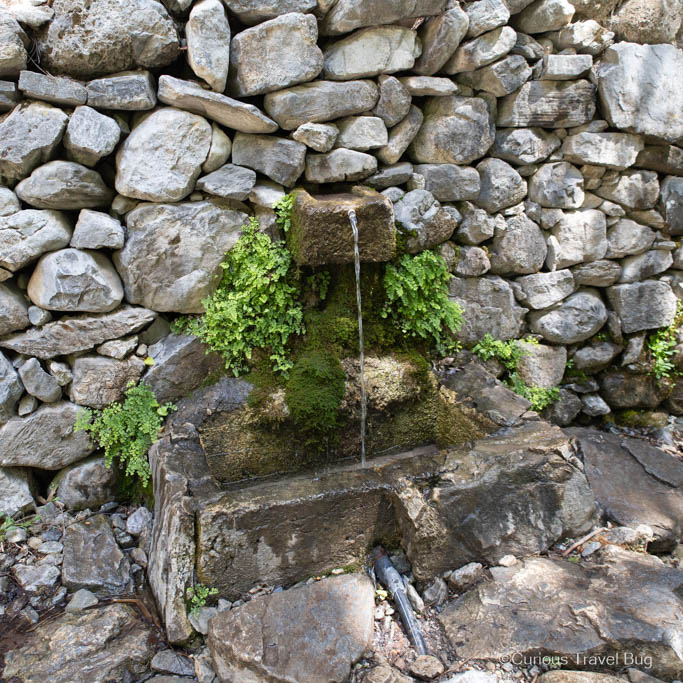 A natural spring water fountain with water flowing in Samaria Gorge