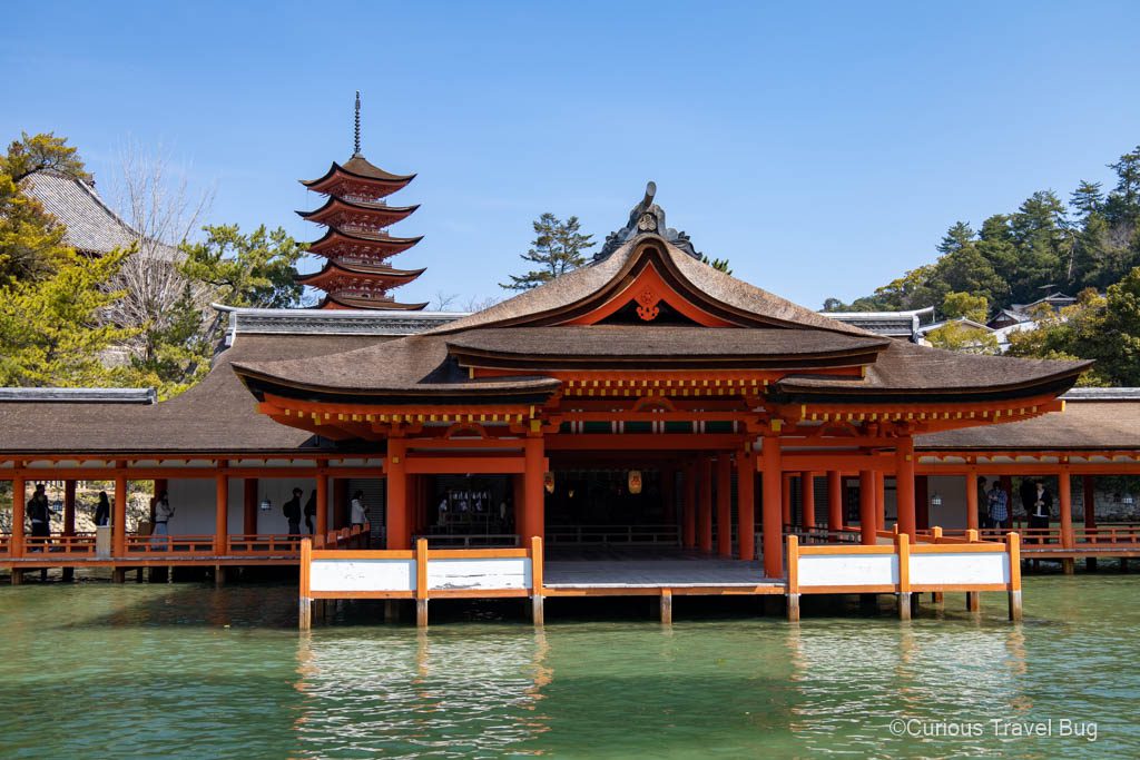 Itsukushima Shrine at high tide with a five story pagoda in the background on Miyajima Island near Hiroshima, Japan. This is a must visit for any first time visitor to Japan